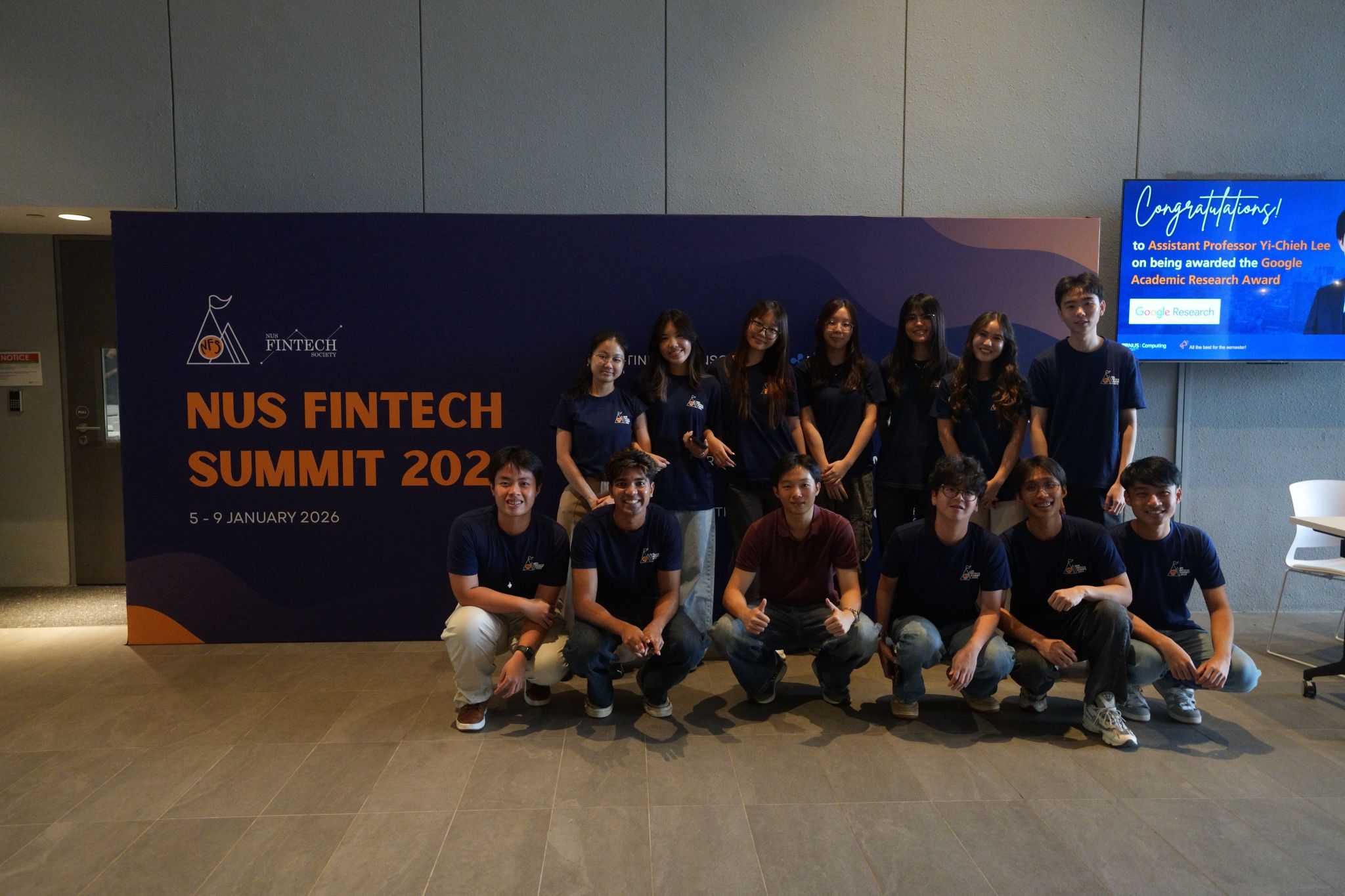 NUS FinTech Summit 2026 — participants in front of the official Summit backdrop